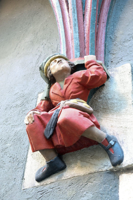 figurine on building